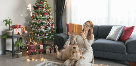 woman celebrating Christmas with her dog